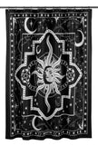A black and white shower curtain with a white sun hanging on a shower rod.