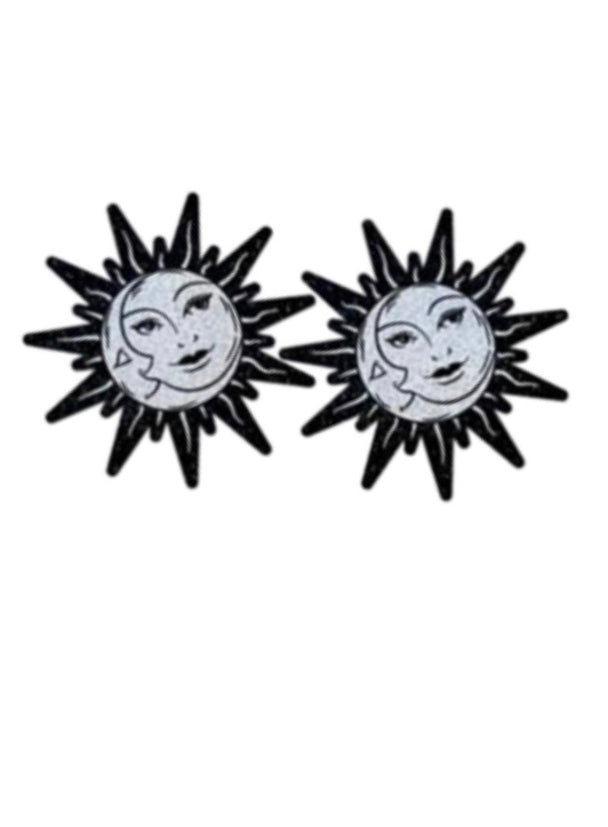 A close up of a pair of pastease silver glitter stars astrology nipple cover pasties showcased on a white background.