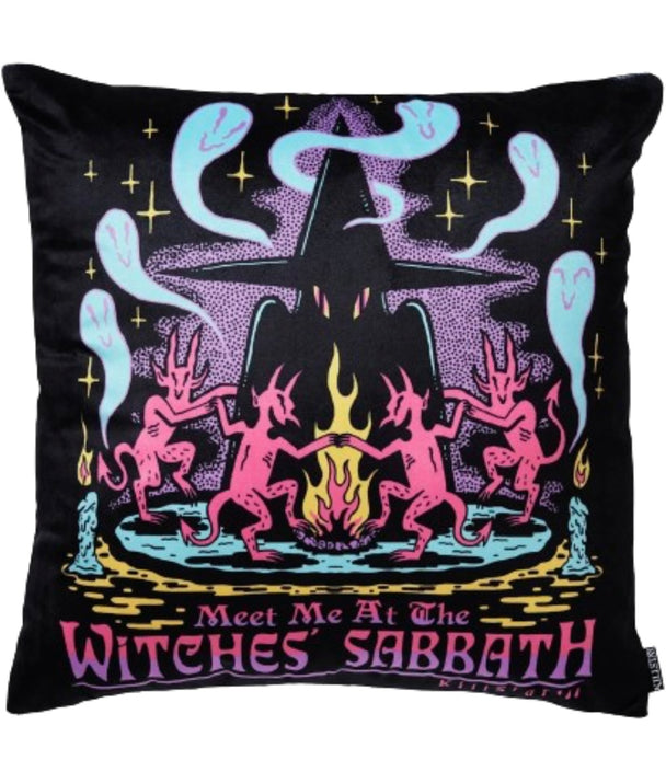 A black pillow with a group of pink and purple characters.