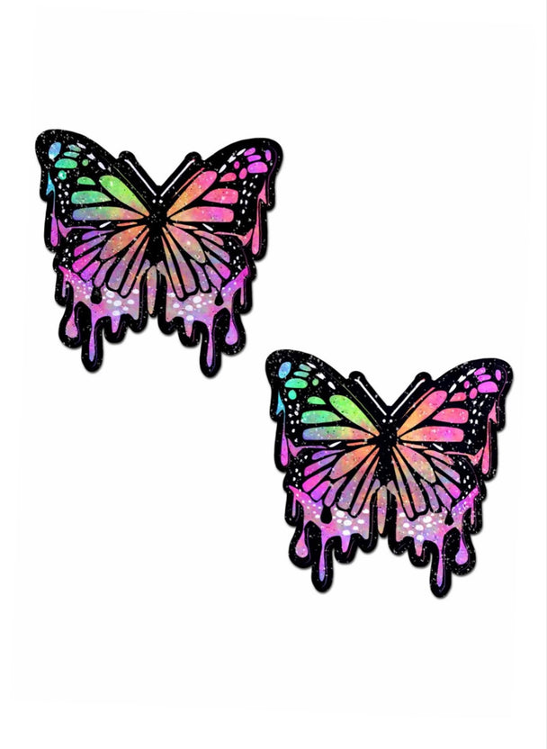A pair of vibrant colored butterfly nipple cover pasties showcased on a white background.
