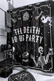 A black shower curtain with white text and skeletons.