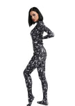 A female posing sideways wearing a bats full body bodysuit in black without the full head mask.