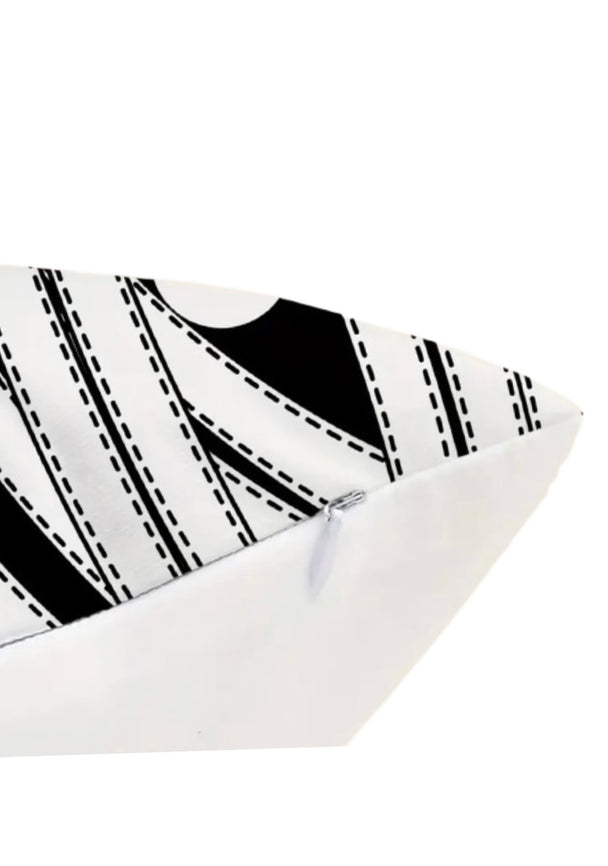 A closeup of a pillow with a zipper closure.