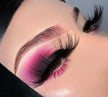 A close up of a woman’s face and eyes wearing bold color eyeshadow and a pair of It Was All A Dream Premium 3d Mink - 25mm False Eyelashes.