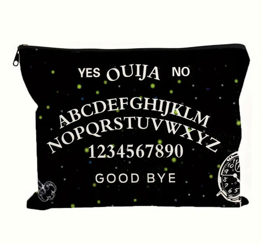 A gothic print makeup bag in black with “ ouija yes no goodbye “ written on it showcased on a white background.