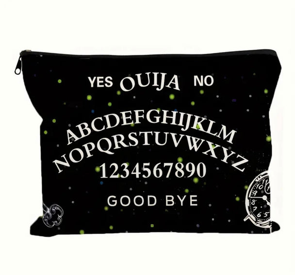 A gothic print makeup bag in black with “ ouija yes no goodbye “ written on it showcased on a white background.