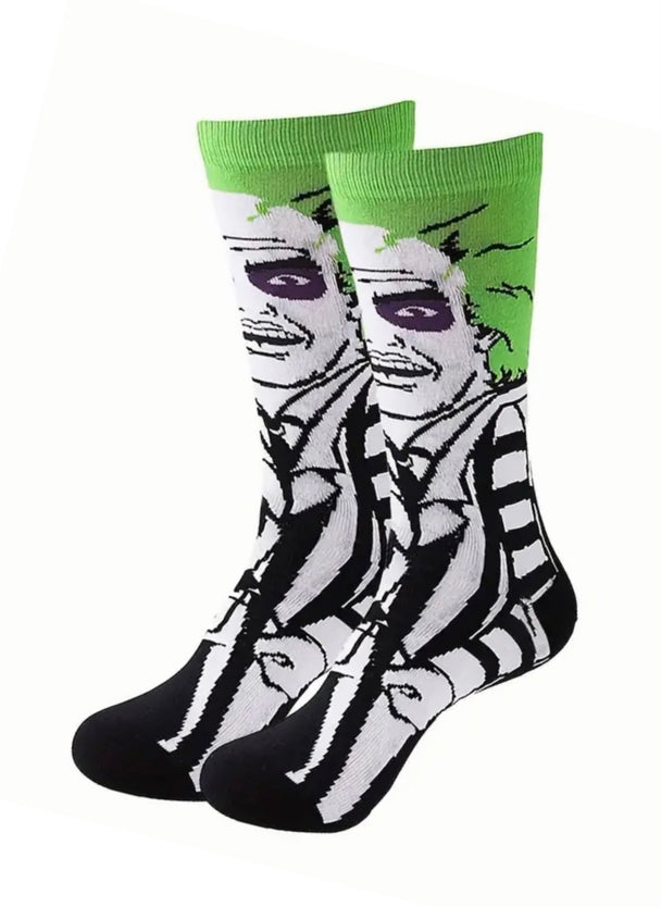 Beetle Juice Socks. Black socks with a green stripe and a beetle juice pattern. Perfect for fans of the movie or insect enthusiasts.