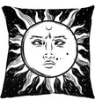 A black pillow cushion with a white sun.