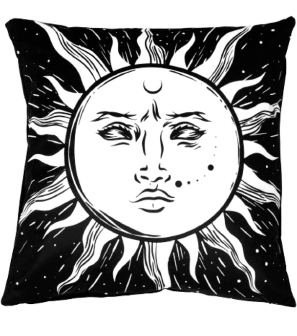 A black pillow cushion with a white sun.