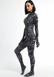 A female posing sideways wearing a spider web full body bodysuit in black without the full head mask.