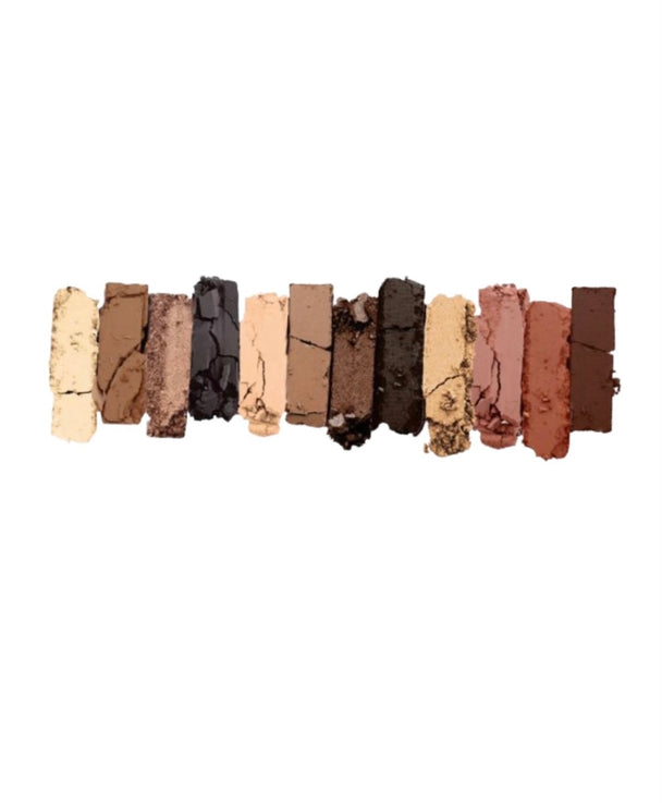 A close-up of twelve basic nude eyeshadow colors.