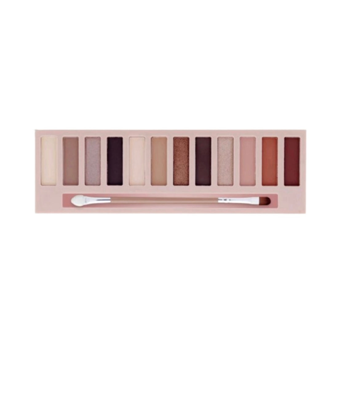 A close-up of twelve different shades of nude eyeshadow colors and an application brush.