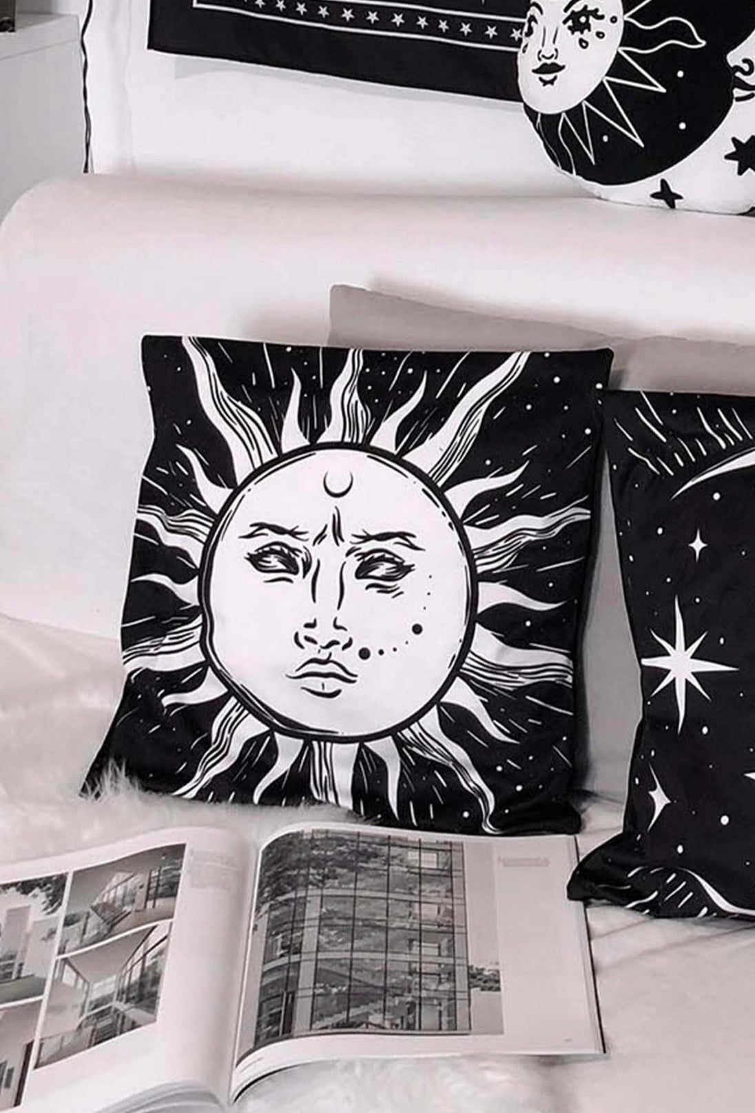  Black pillow cushion with a white sun.