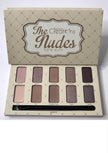 A close-up of a makeup palette with ten nude shades.