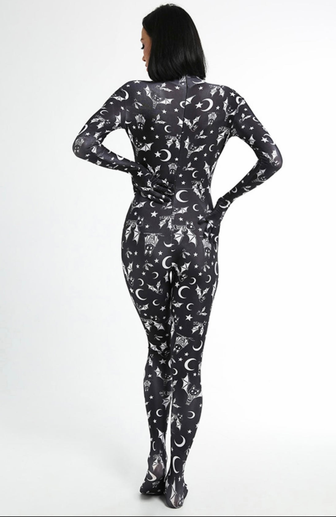A female posing from the back wearing a bats full body bodysuit in black without the full head mask.