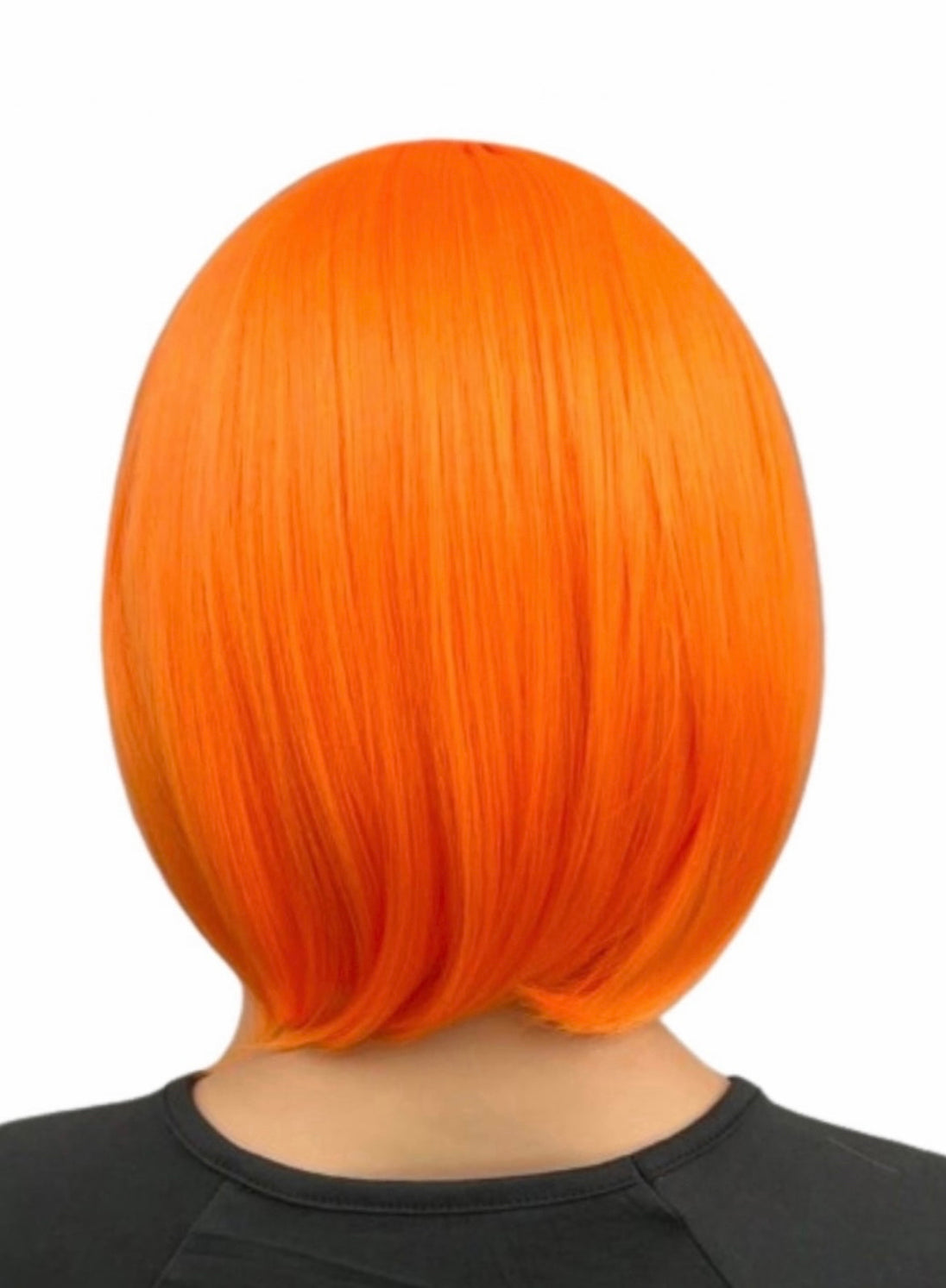 A female posing from the back wearing a orange flapper wig.