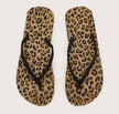 A pair of leopard patterned flip-flops. Perfect for casual summer wear and walks on the beach.