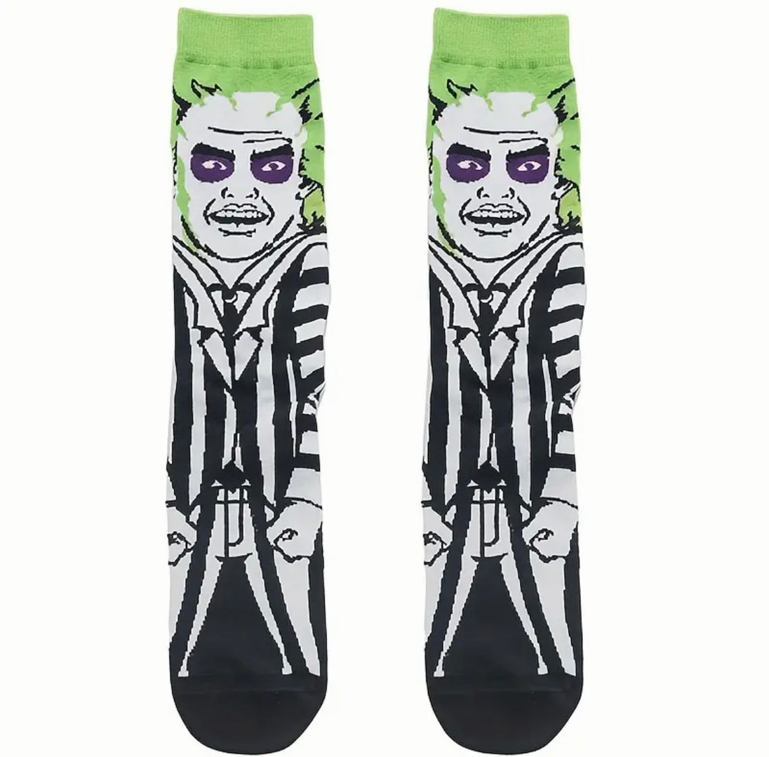 Beetle Juice Socks. Black socks with a green stripe and beetle juice pattern. Perfect for fans of the movie or insect enthusiasts.