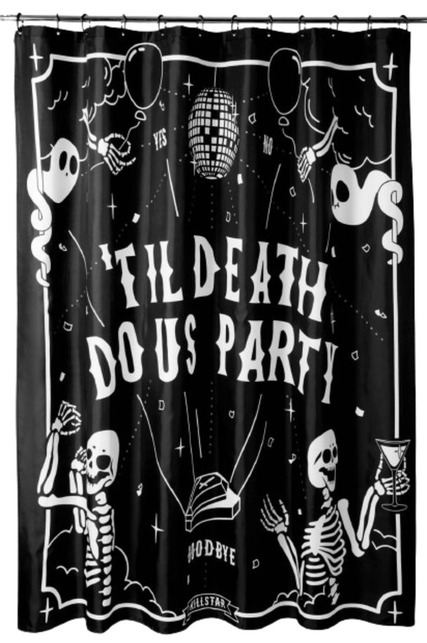 A black shower curtain with white text and skeletons hanging on a shower rod.