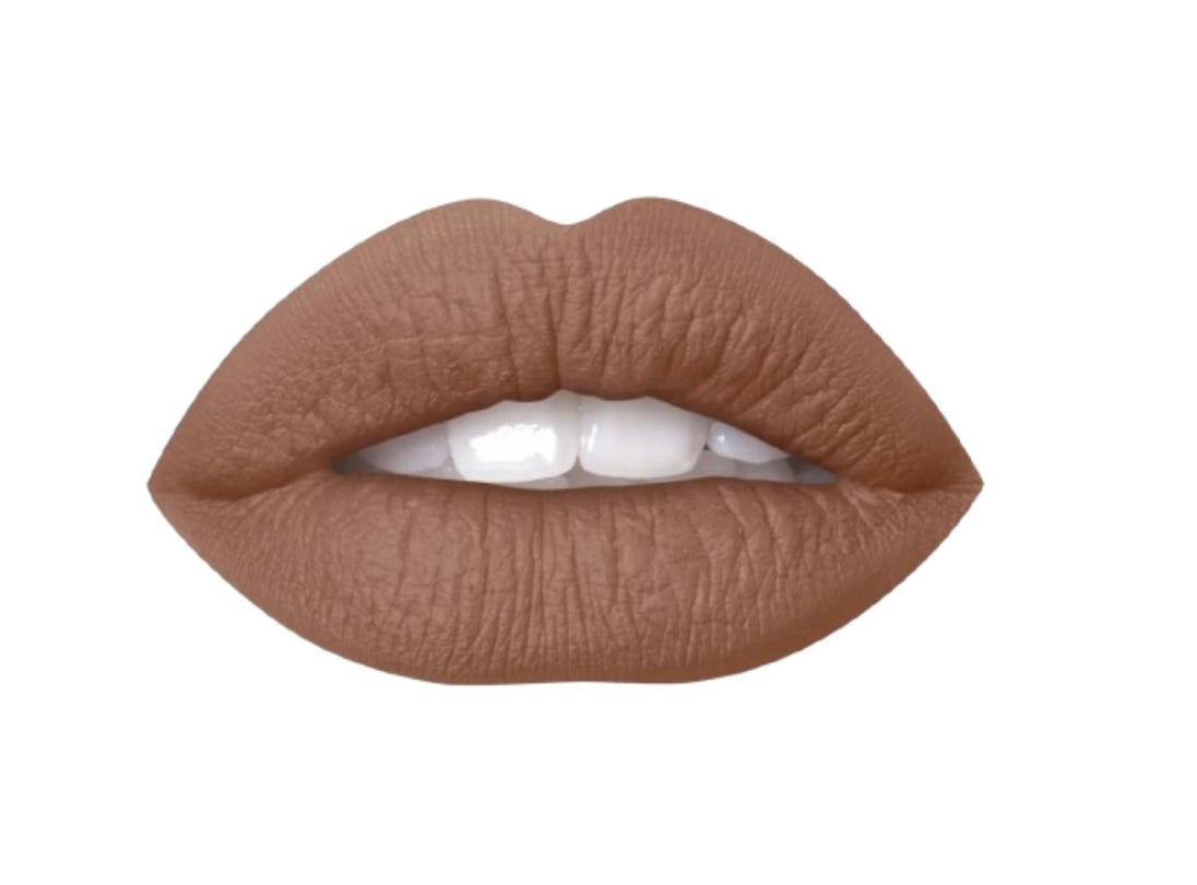 A persons lips wearing air matte liquid lipstick in the shade of mocha.