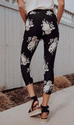 Black and white floral print capri leggings for yoga, workout or lounging.