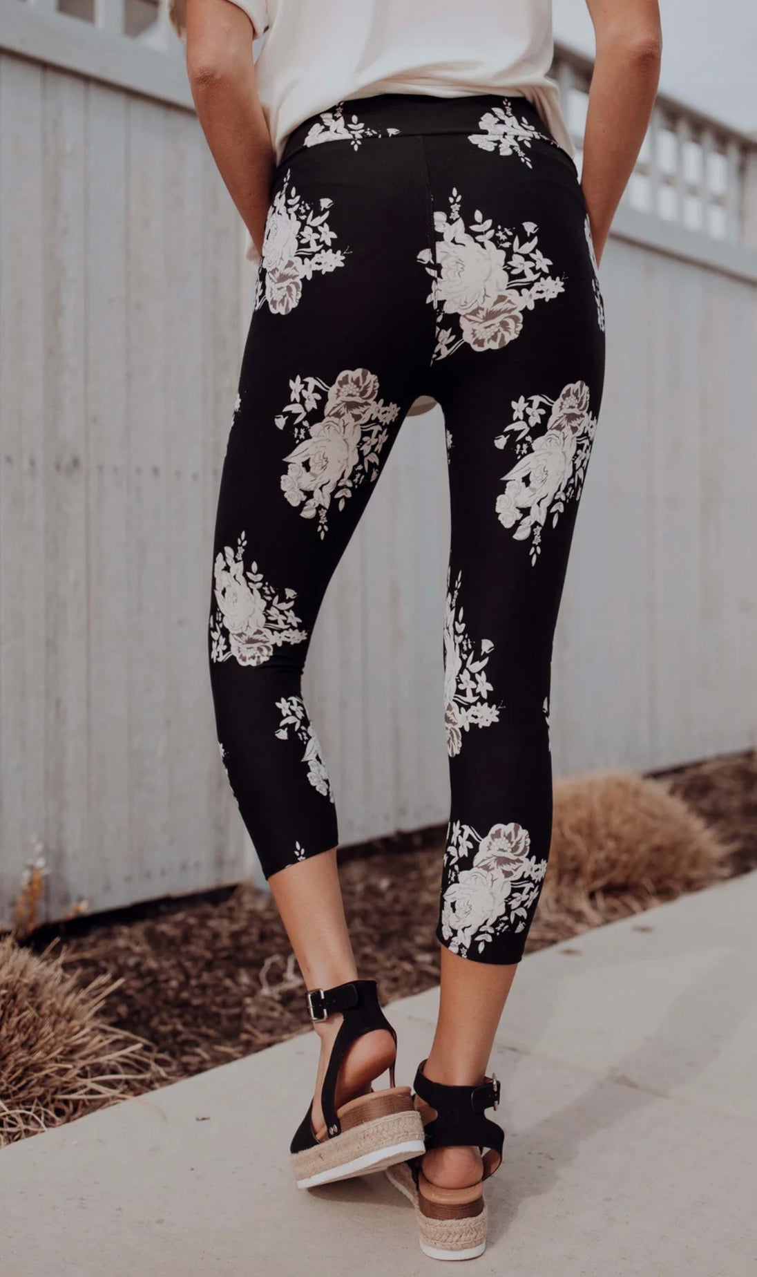 Black and white floral print capri leggings for yoga, workout or lounging.