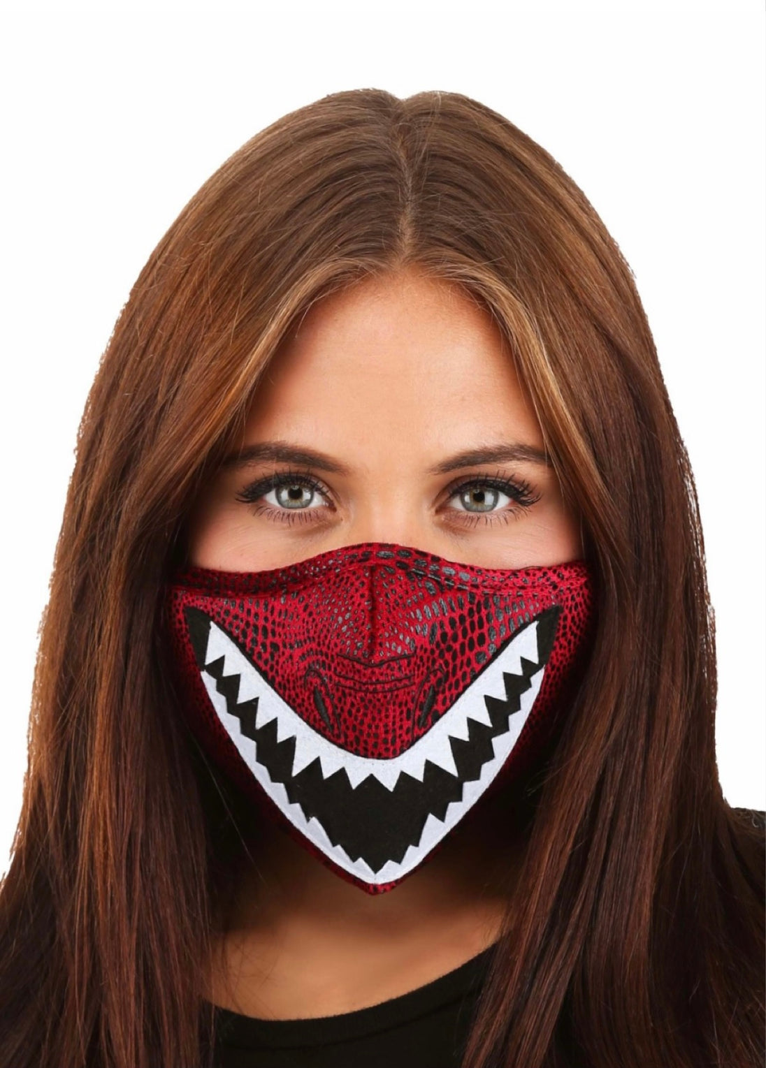 A female wearing a red face mask with white dragon teeth on it.